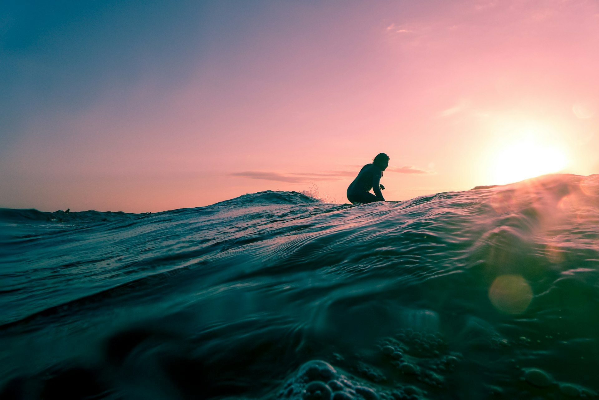 Surfer riding a wave at Ericeira