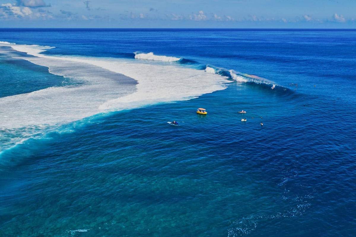 An image of a person surfing The World’s Heaviest Wave in Teahupo’o, Tahiti
