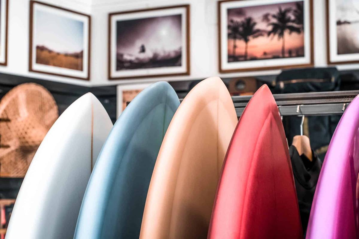 Closeup of 5 Surf Boards of Different Colors Lined up