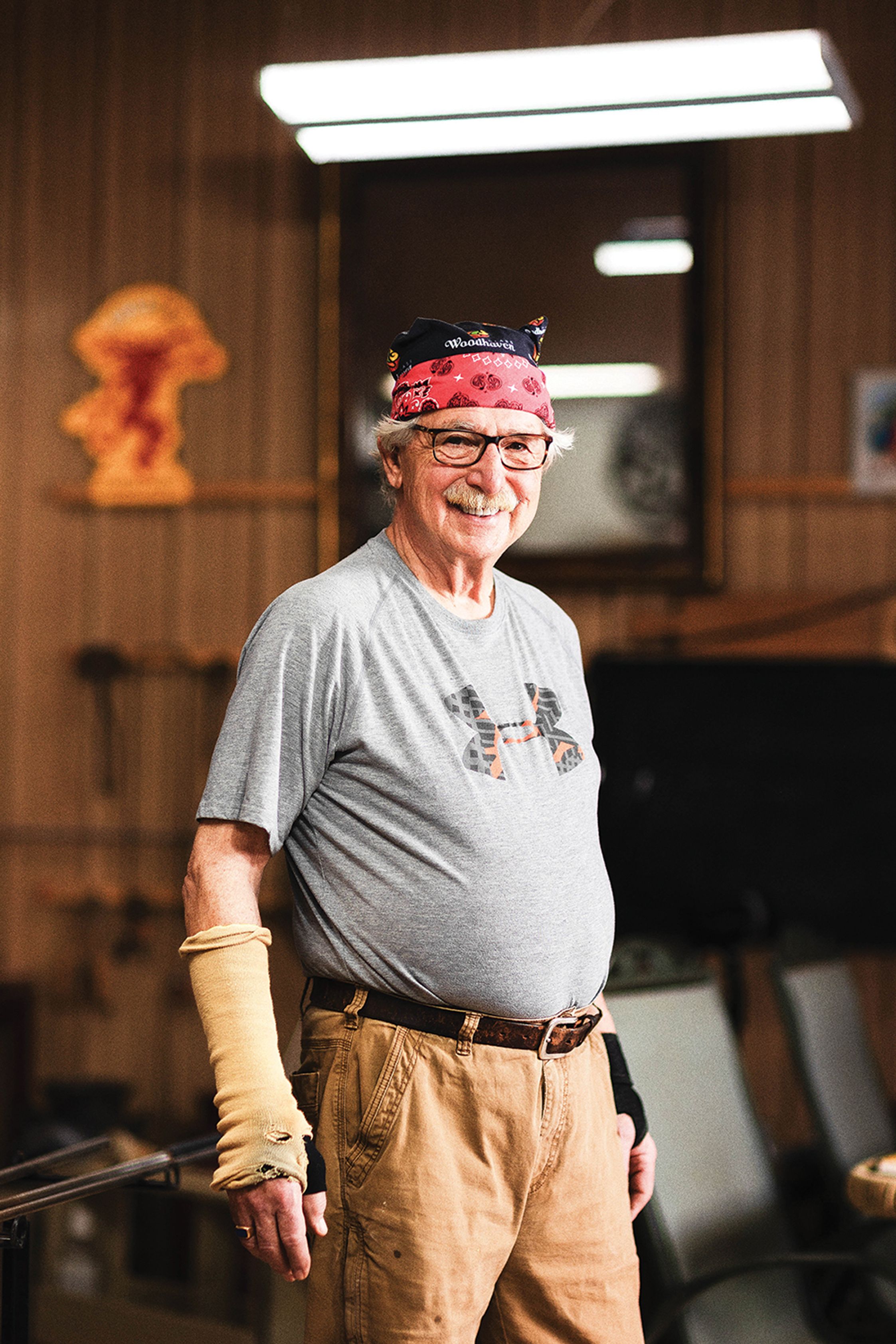 A portrait of Larry smiling in his studio