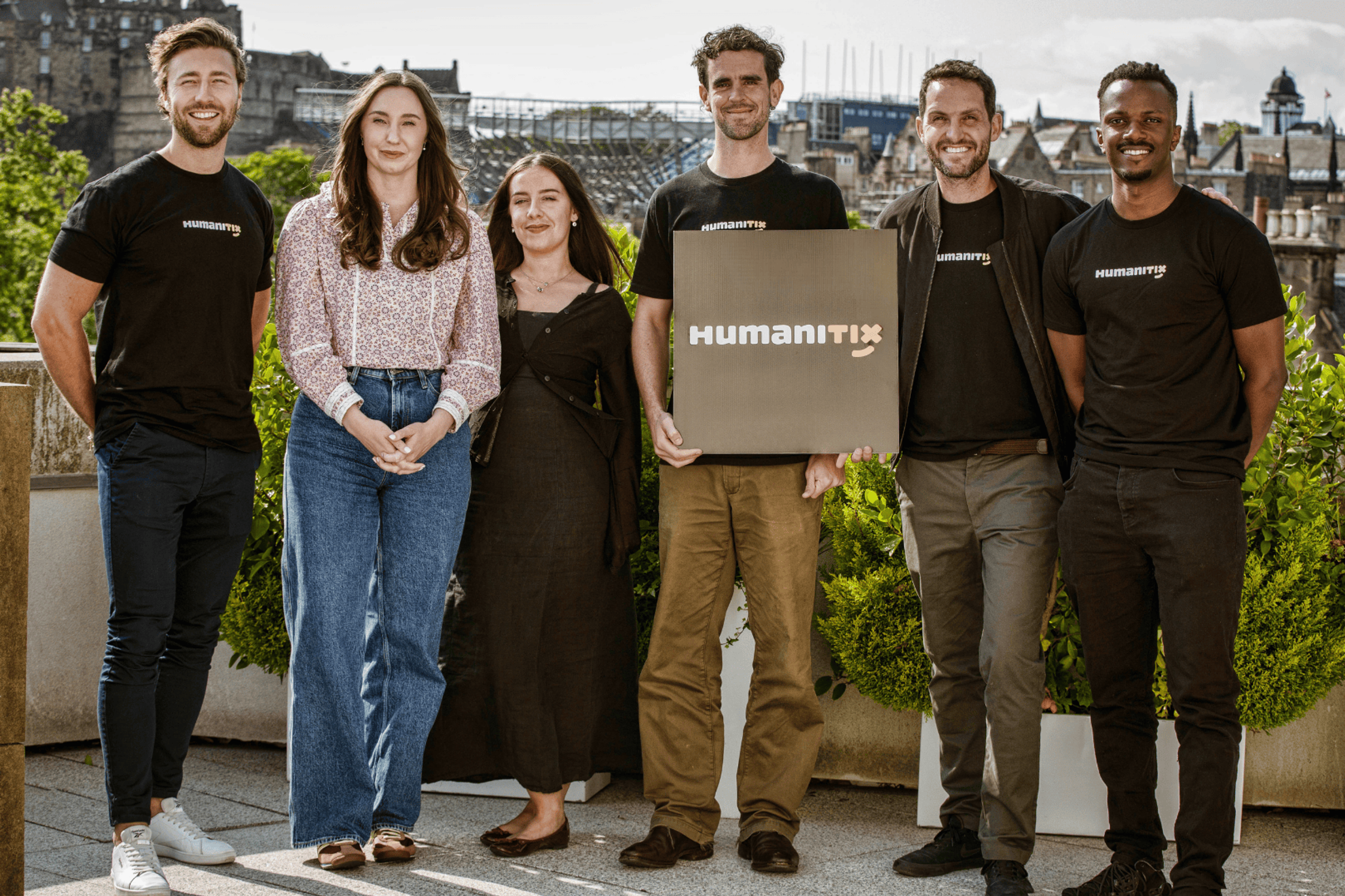 The Humanitix UK team: Matt, Natalie, Liv, Harry, Adam and Melvin holding the Humanitix branded disc