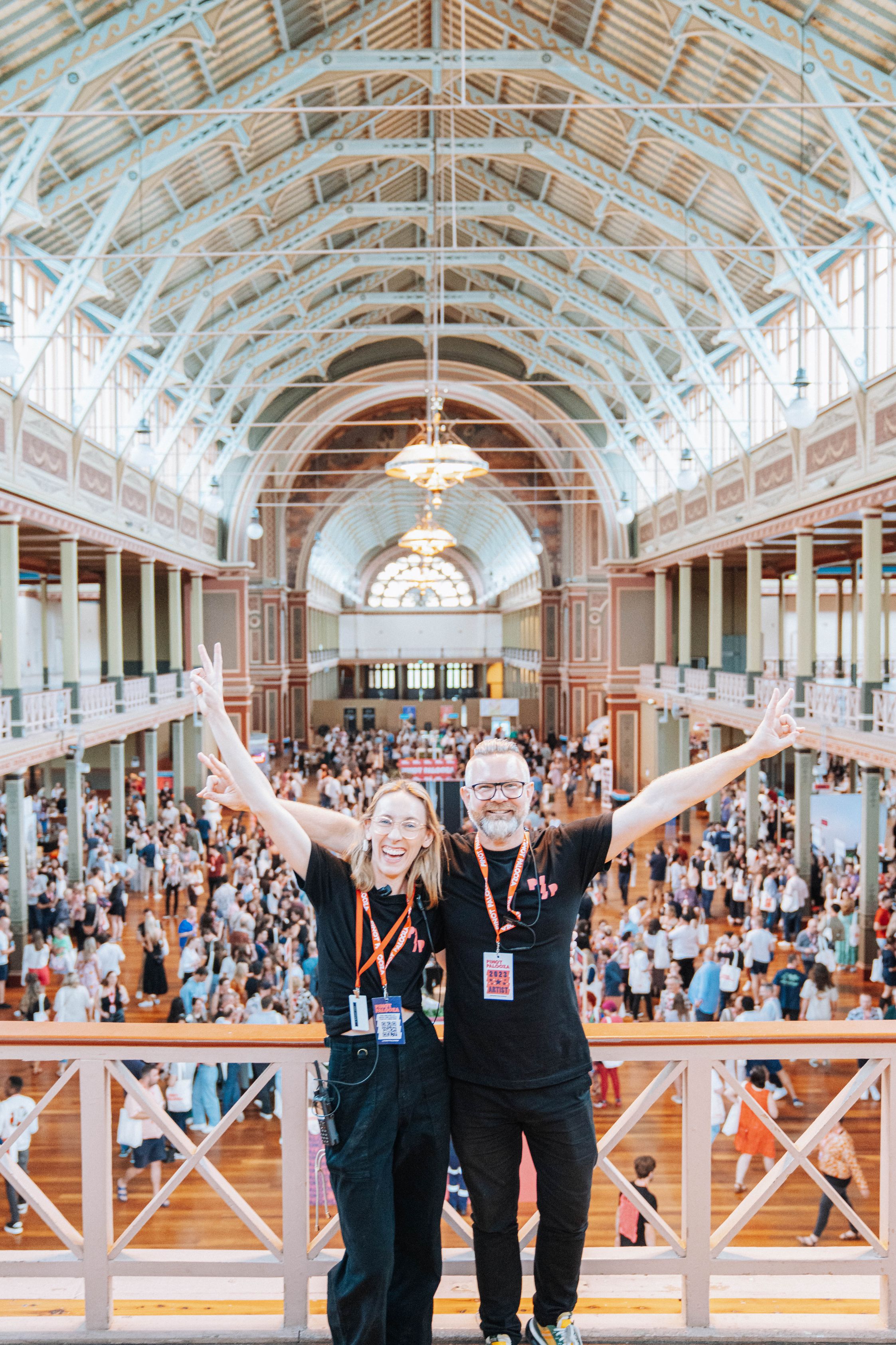 Event staff posing on the second level of the Melbourne festival venue