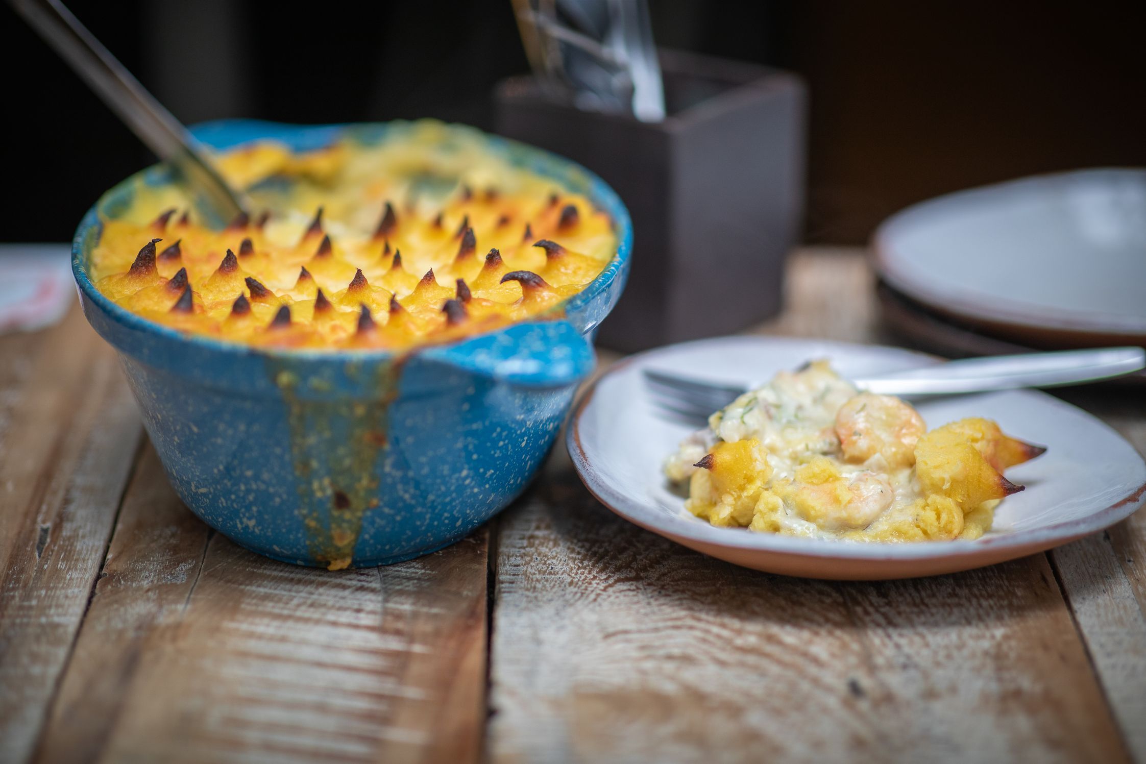 Delicious bowl of food and a serving on a plate