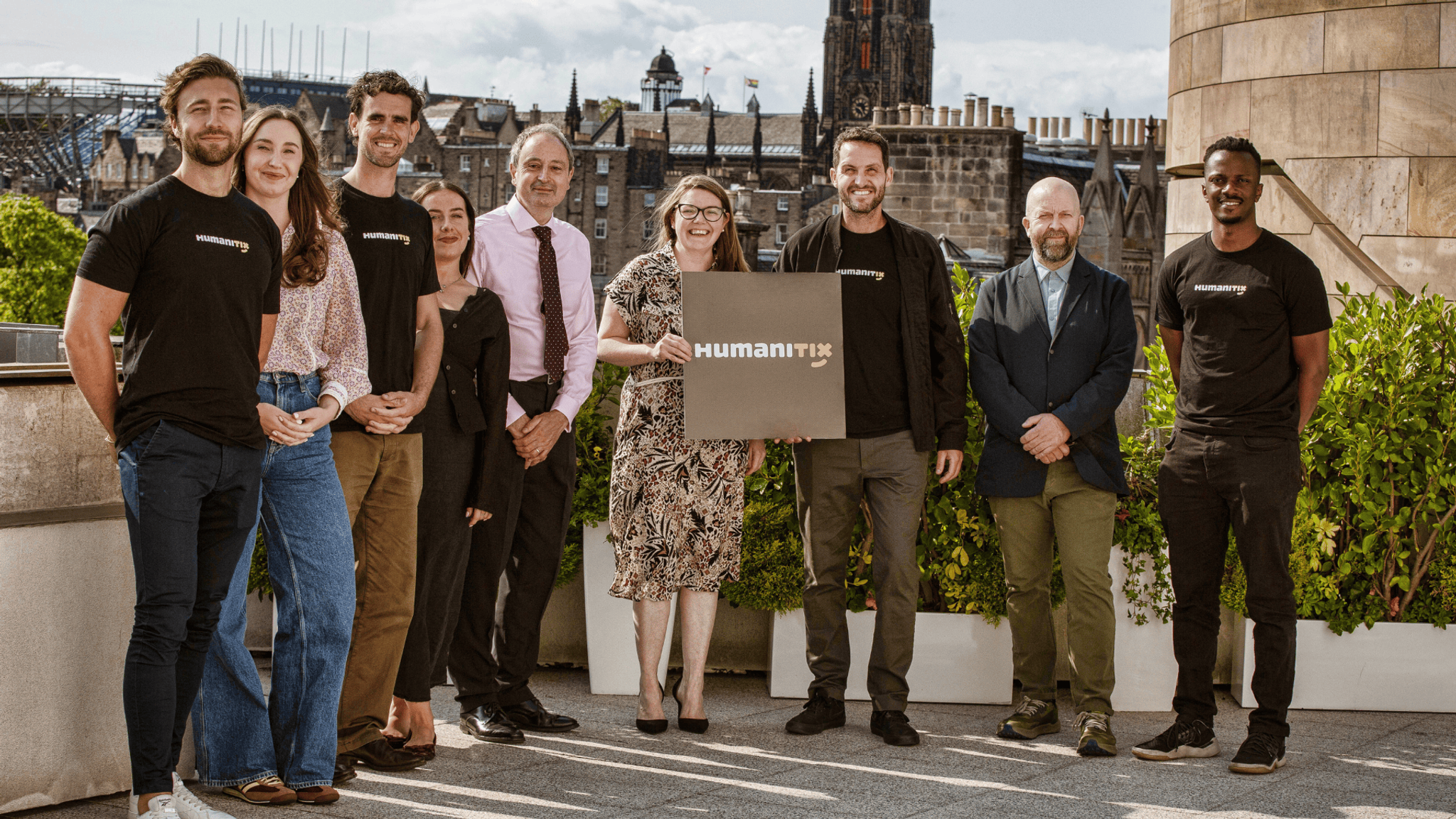 The Humanitix team and supporters at the launch event with a Humanitix sign