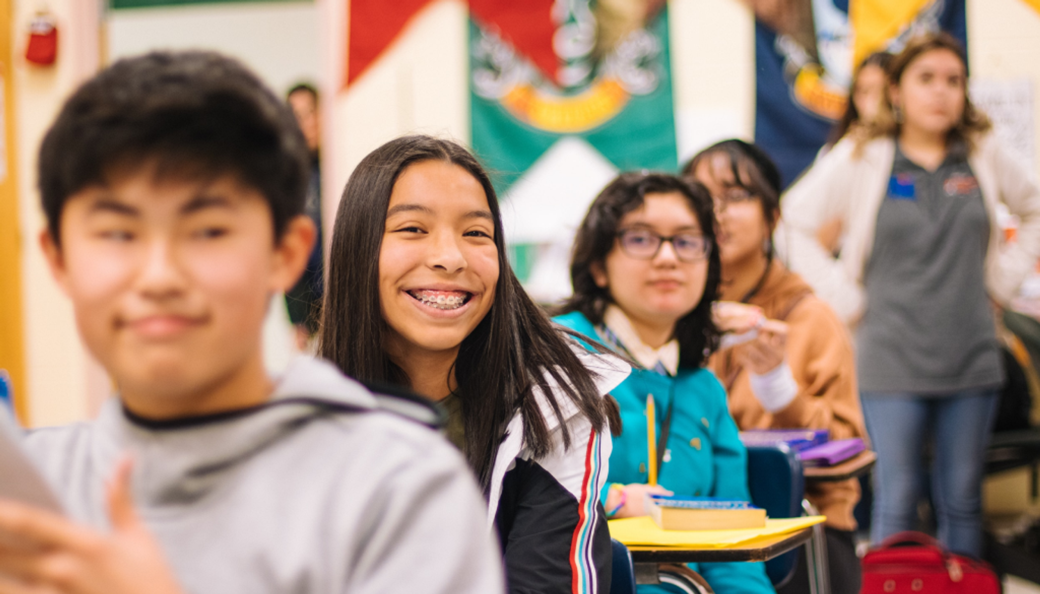 School students smiling at the camera