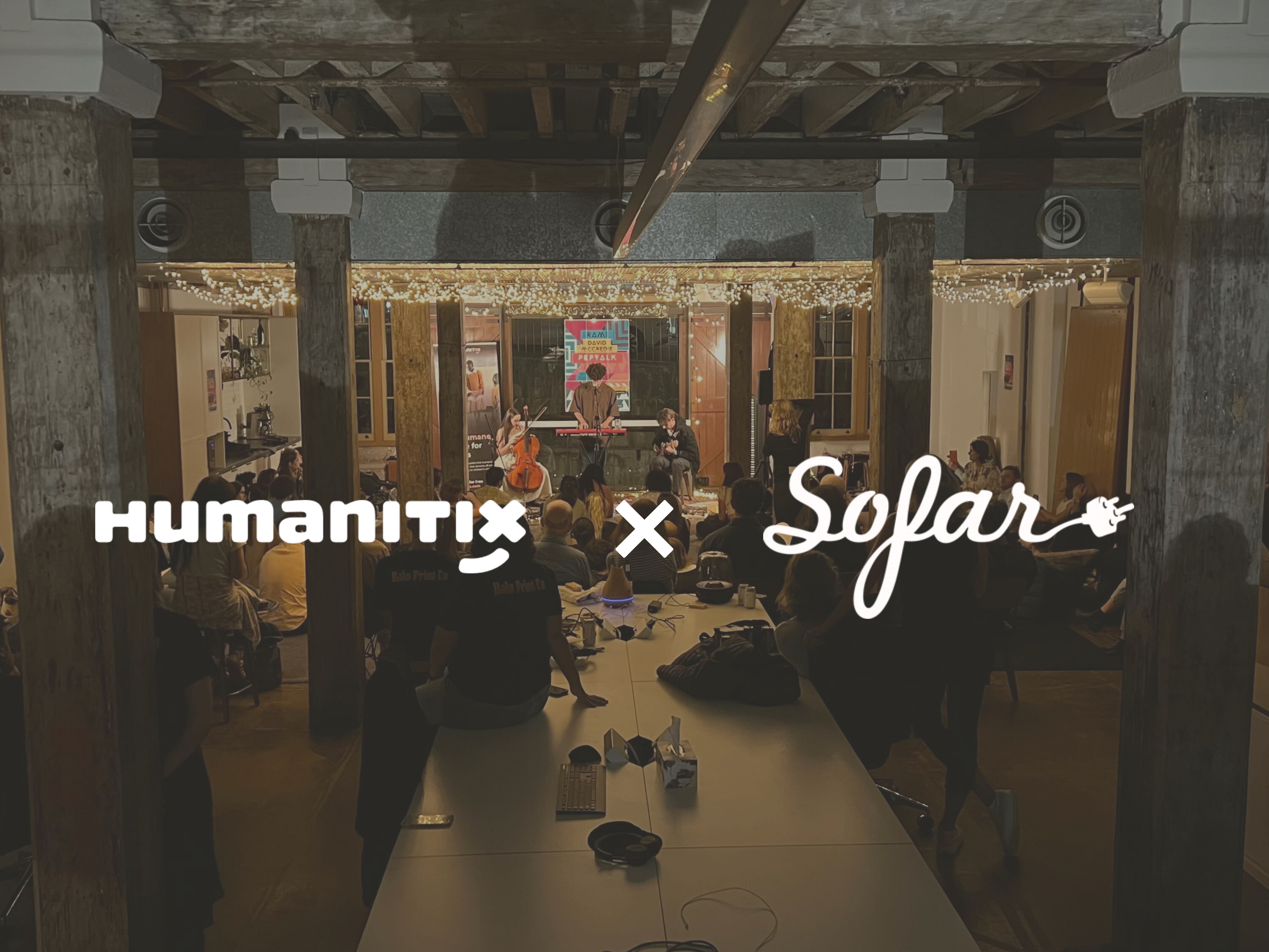 Photo of Rami playing to a seated audience surrounded by candles and fairylights with overlayed logos Humanitix x Sofar