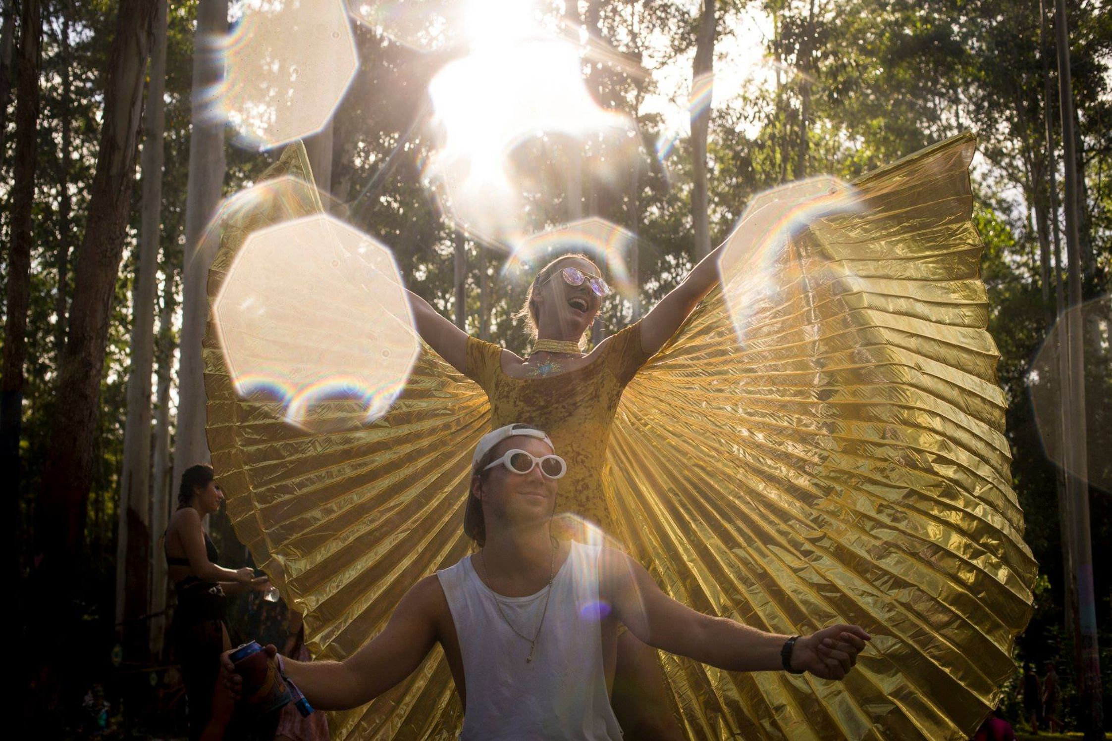 Punters at Rabbits Eat Lettuce with golden wings with bokeh light backdrop