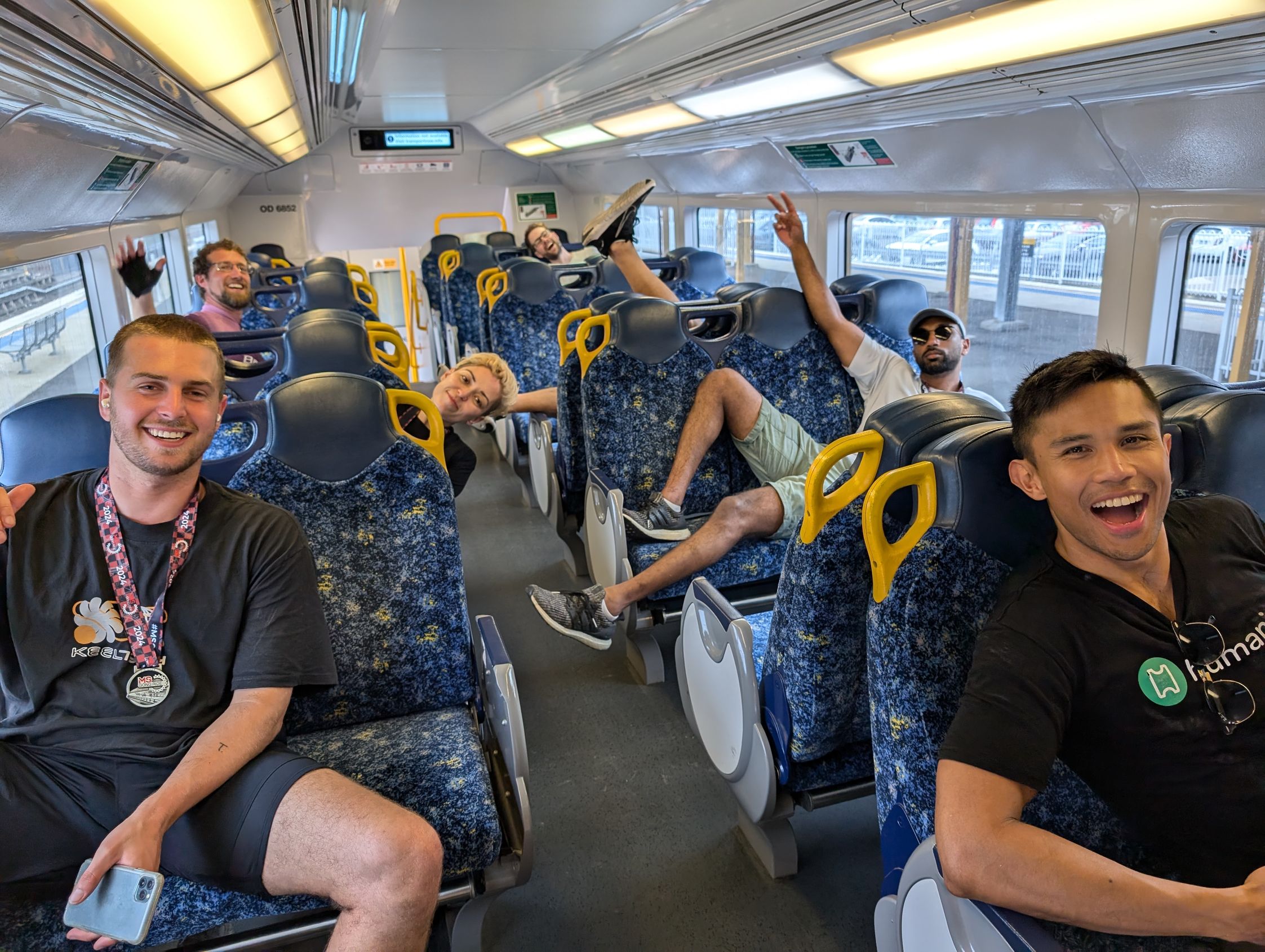 Humanitix team on the train back to Sydney after the ride