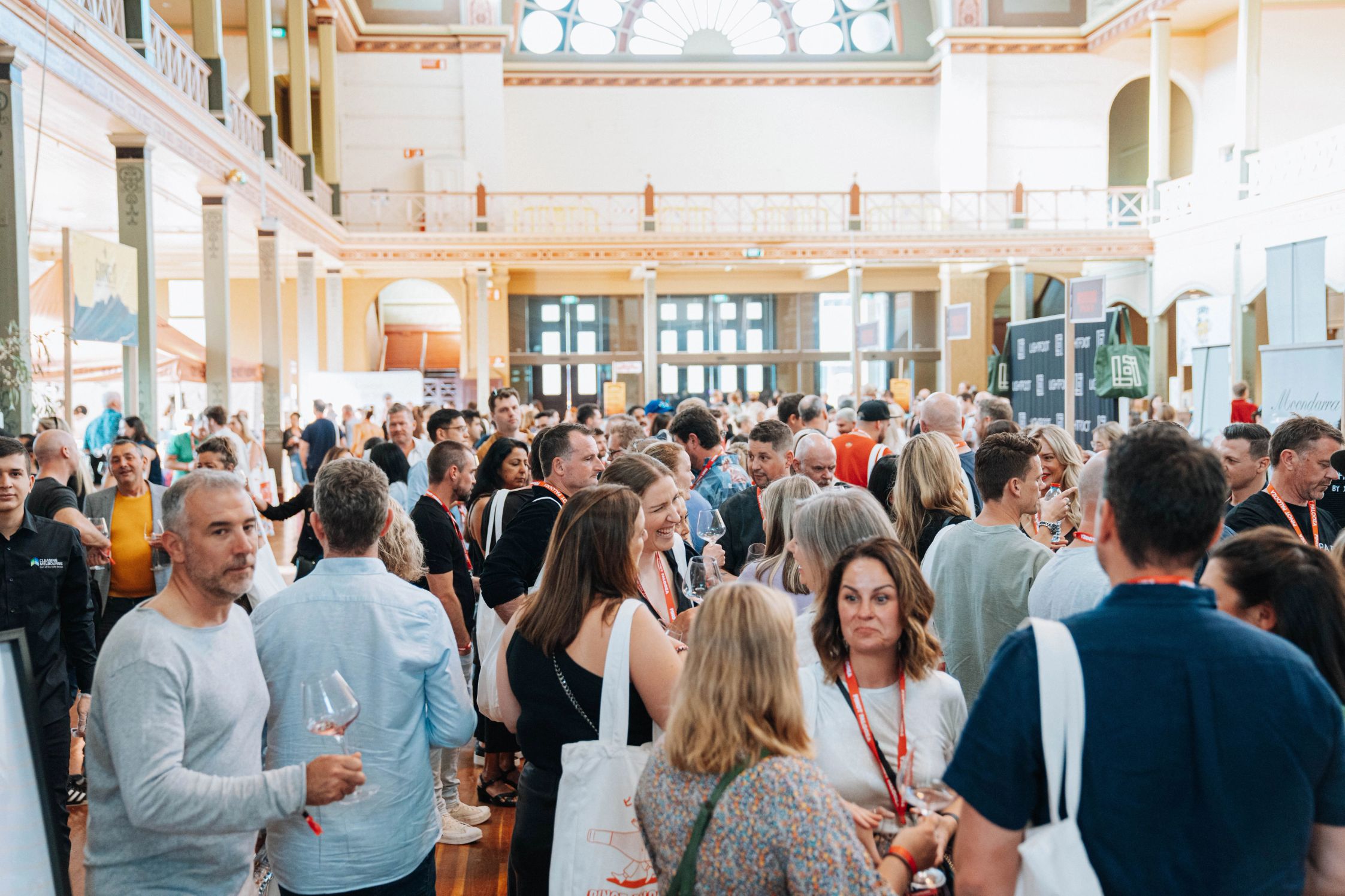 A crowded room with high ceiling packed with attendees of the festival in Melbourne