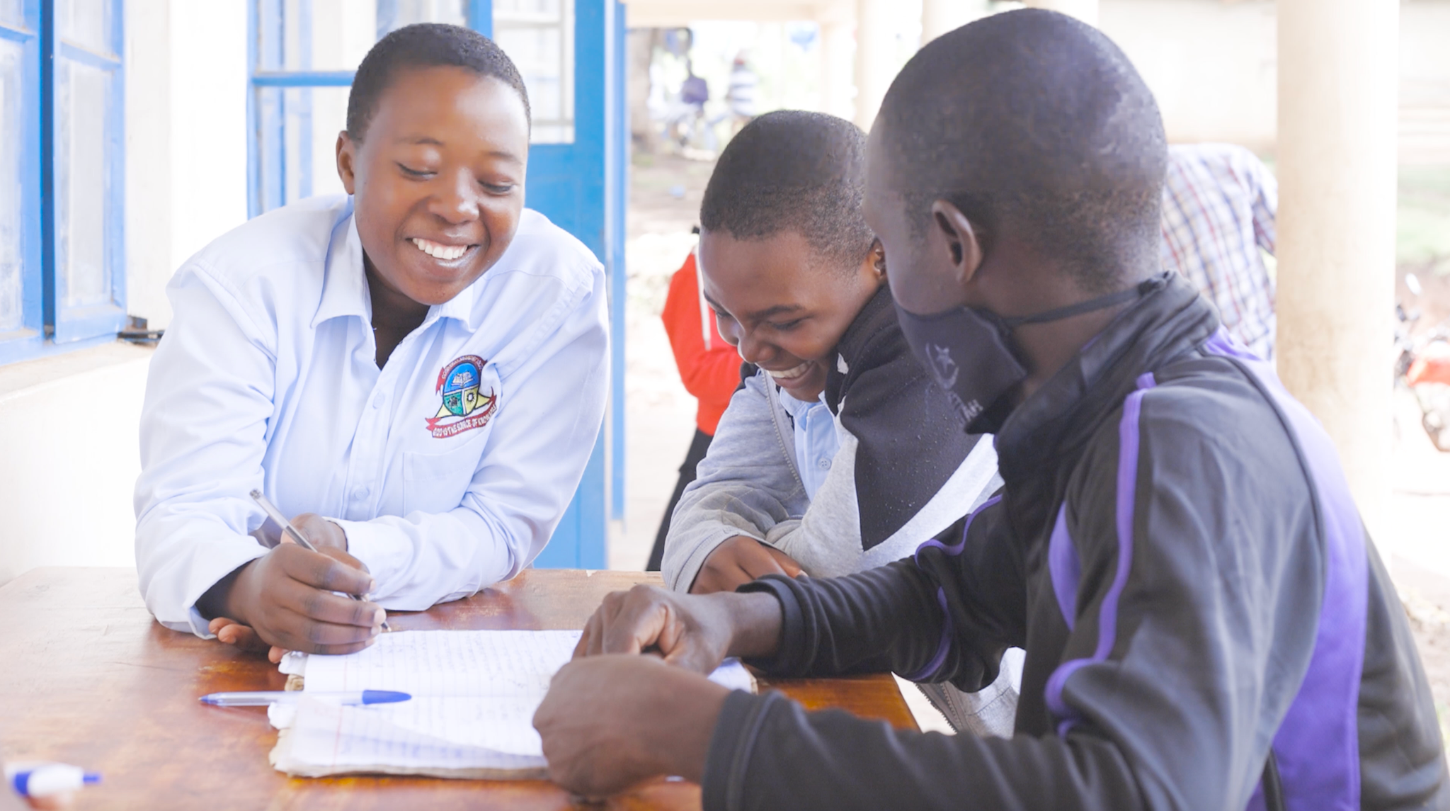 Smiling and laughing students in Uganda