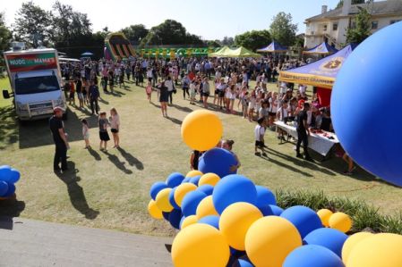 Carey fair with blue and yellow balloons