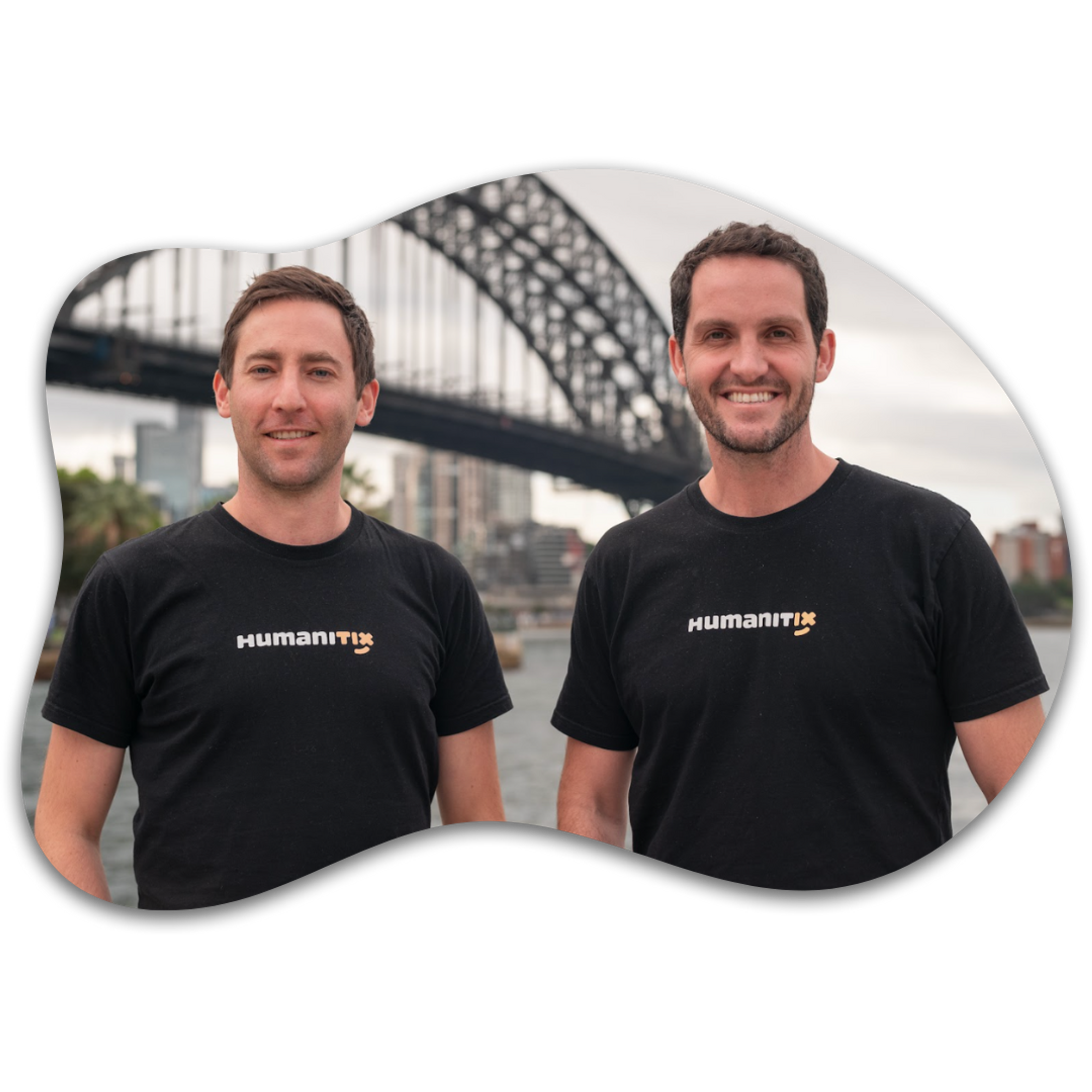 Josh and Adam in Humanitix t-shirts with the Sydney Harbour Bridge in the background