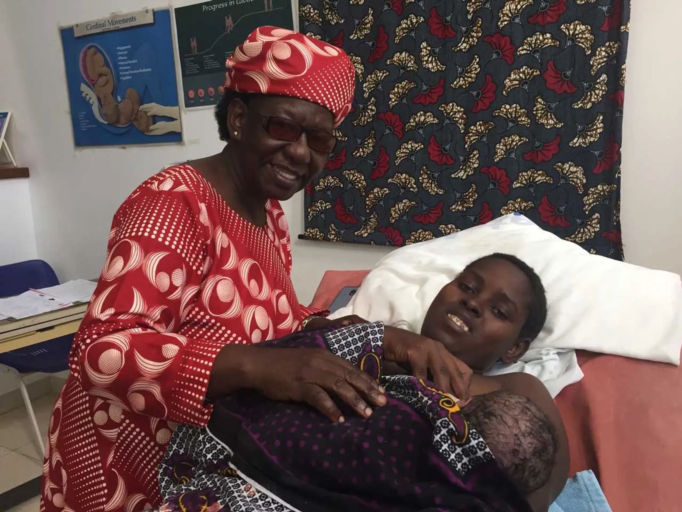 Kivulini CEO Monica Ndege with patient and baby