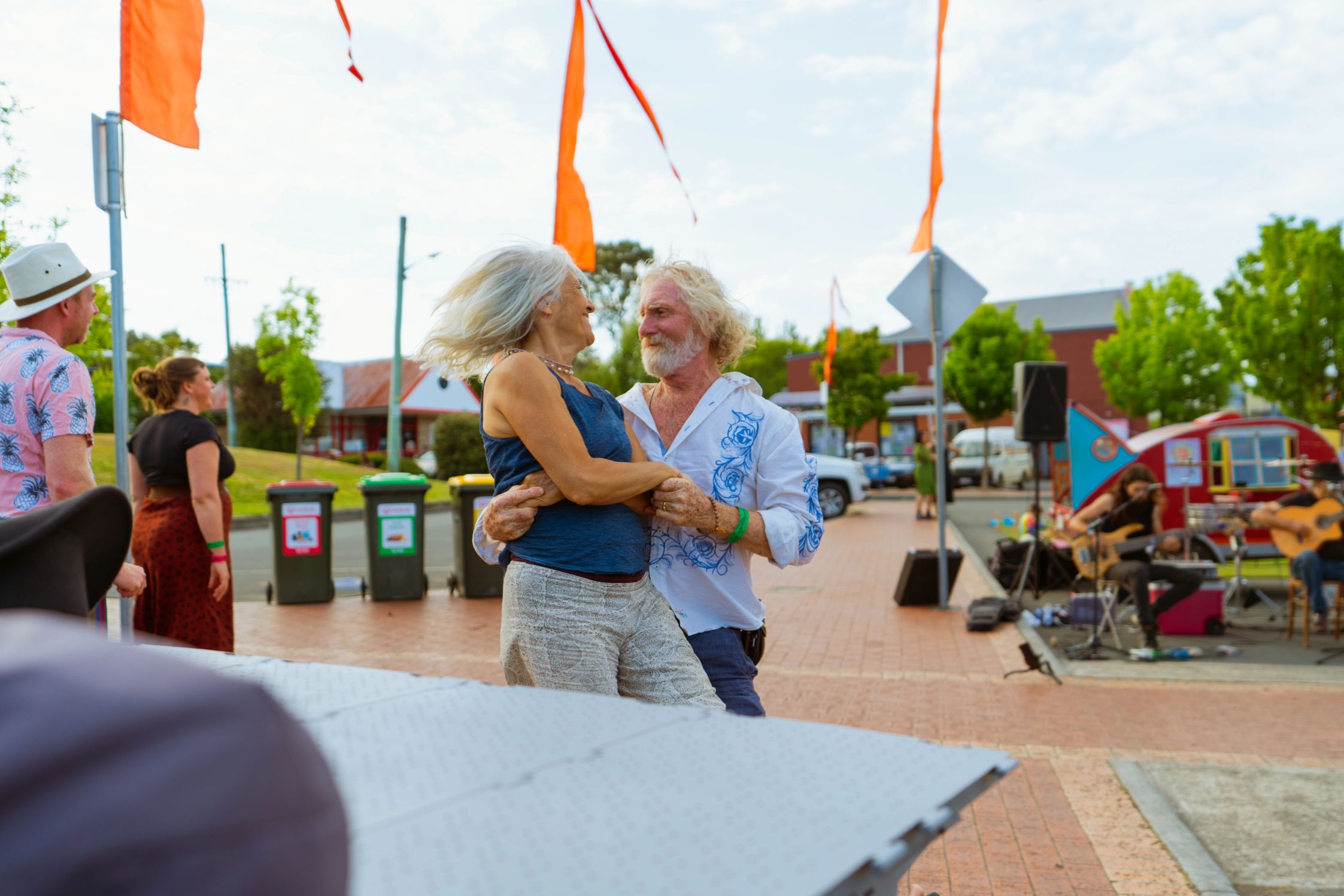 A couple dancing at the festival grounds