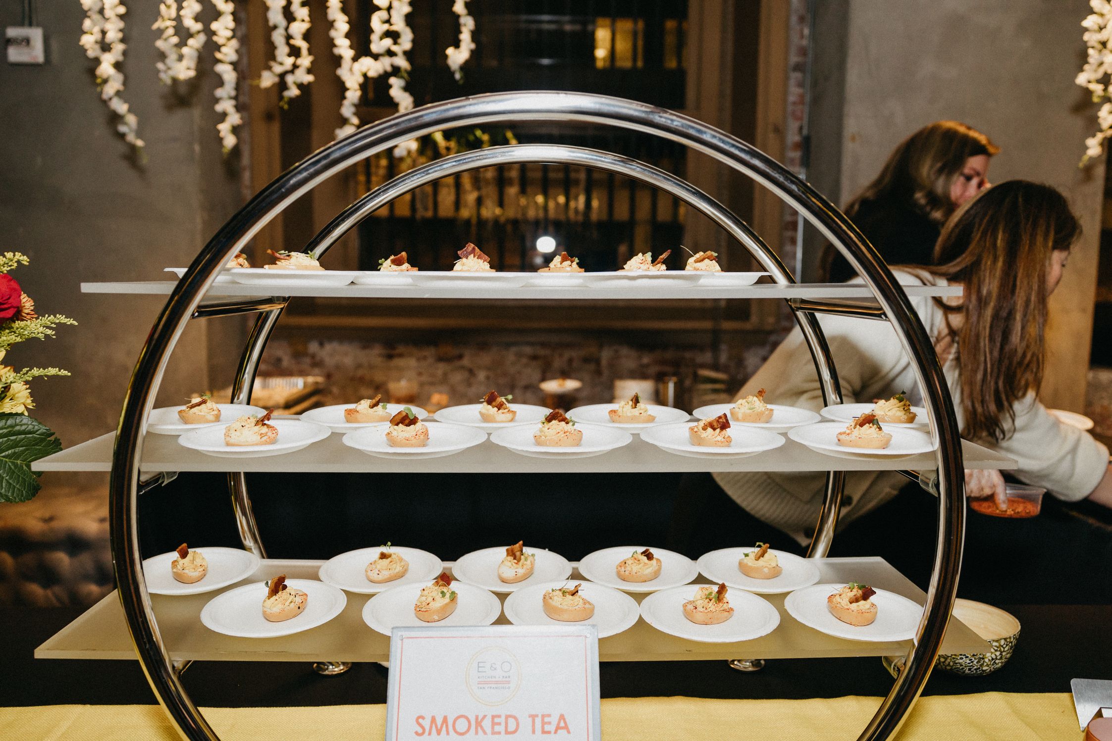 A 3-tiered shelf of desserts beautifully plated at the event