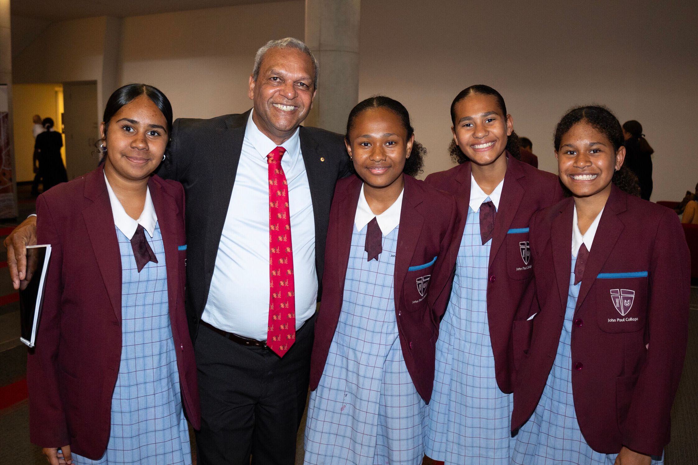 Founder Waverley Stanley with Yalari students in uniform