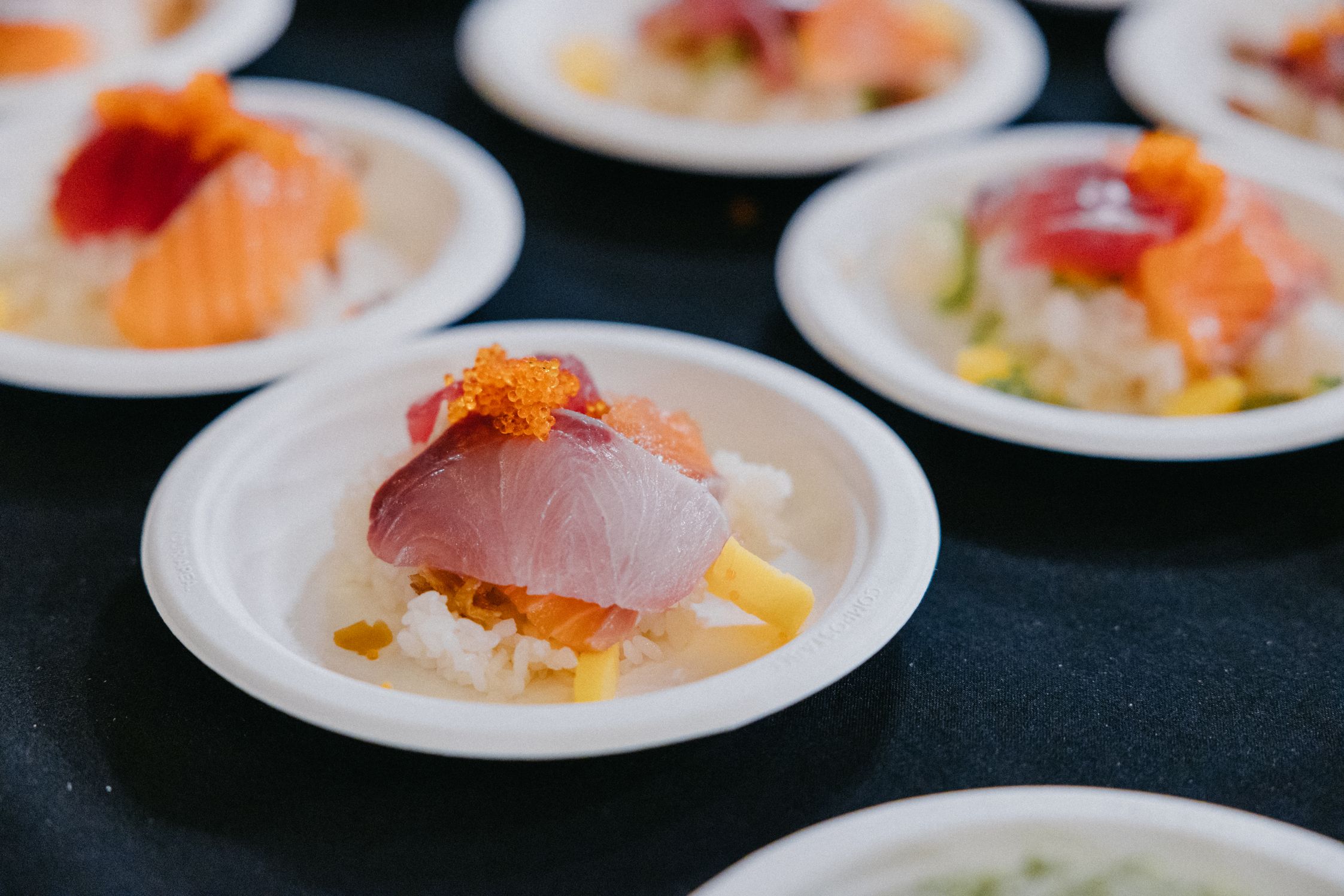 Close-up shot of a beautiful plate of sashimi, rice and roe