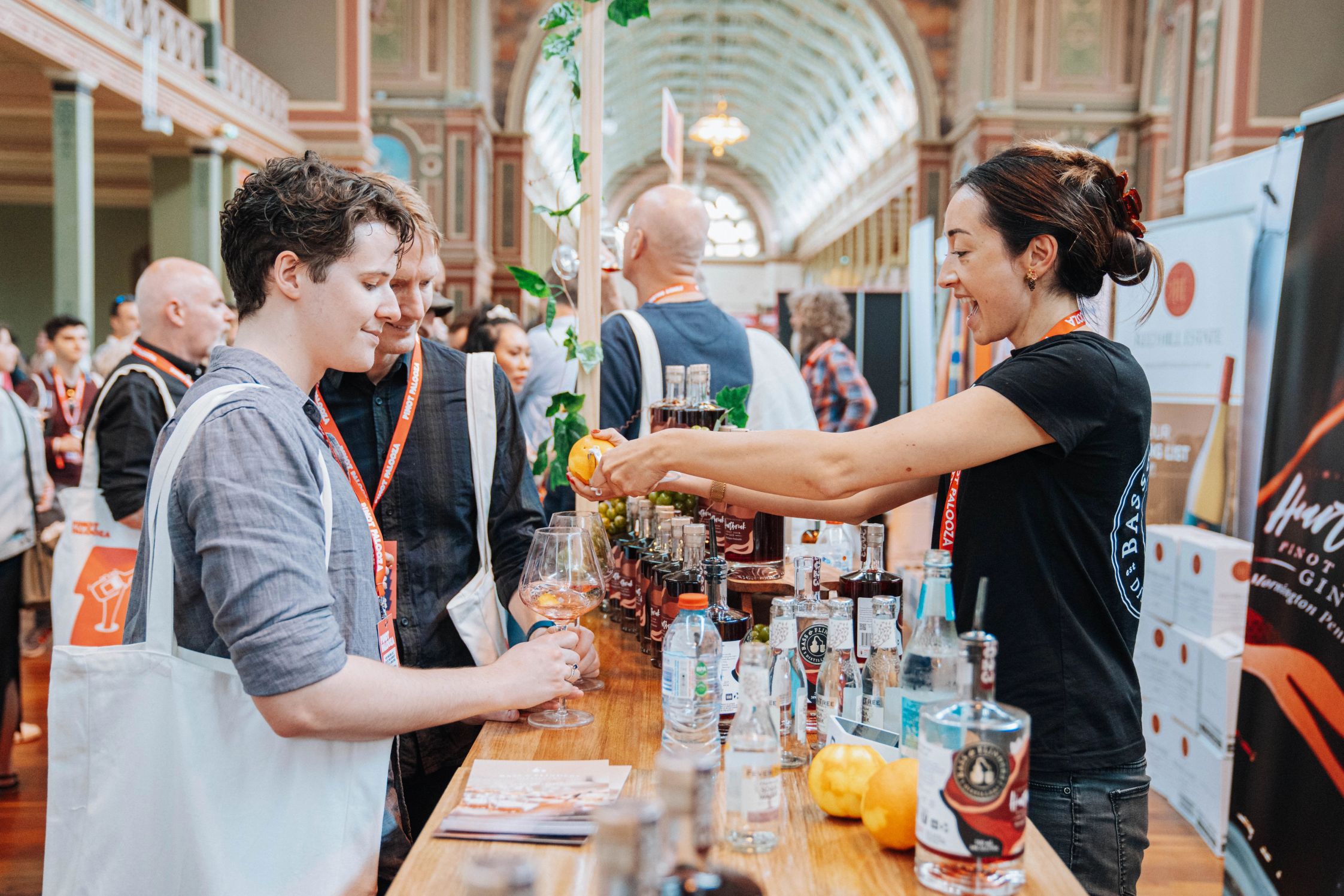 A woman serving wine to attendees at the Melbourne festival