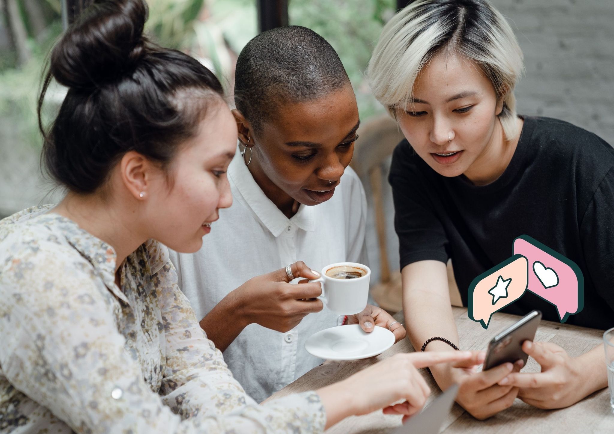 3 friends at a cafe looking at a home. 