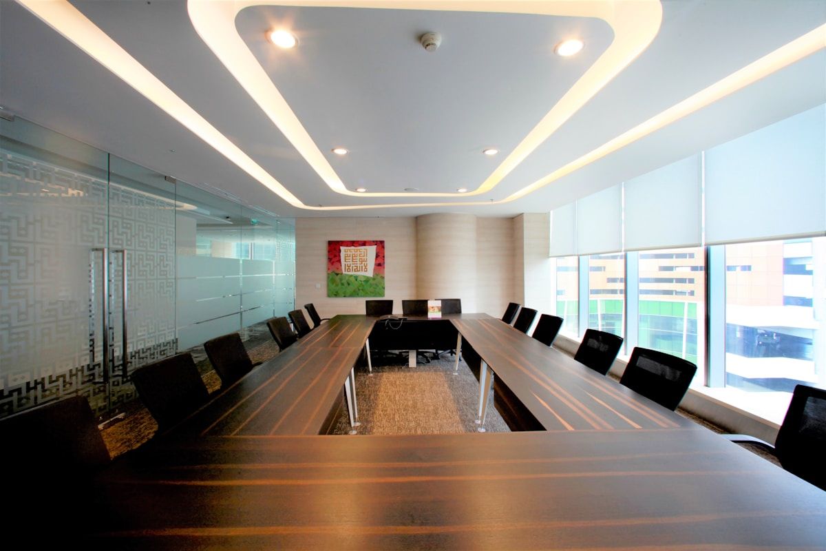 A modern conference room is prepared for meetings.