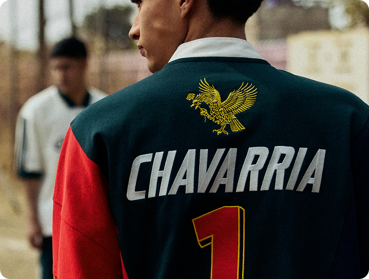 Back of a WILLY CHAVARRIA jacket with an embroidered eagle and wordmark