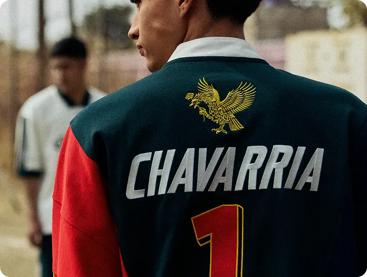 Back of a WILLY CHAVARRIA jacket with an embroidered eagle and wordmark