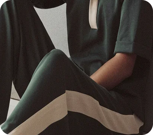 close up shot of person in green clothing