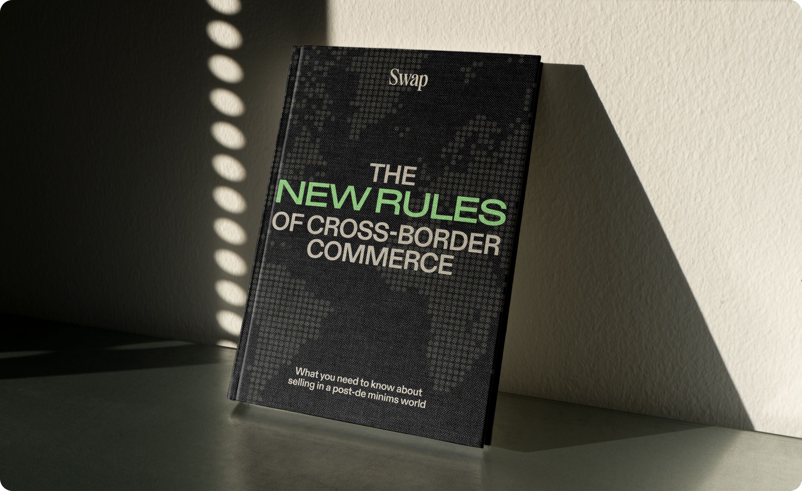 Photo mockup with the cover saying "The new rules of cross-border commerce"