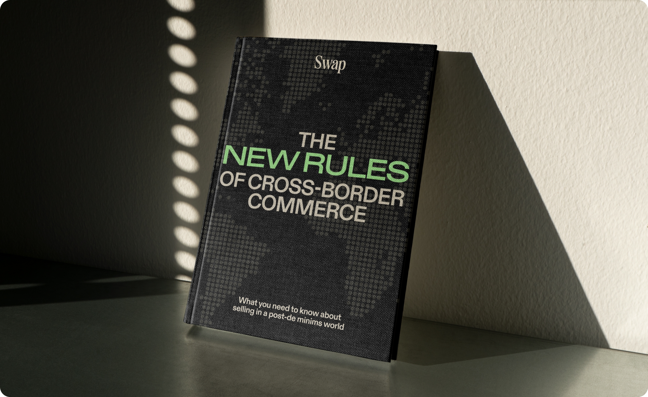 Photo mockup with the cover saying "The new rules of cross-border commerce"