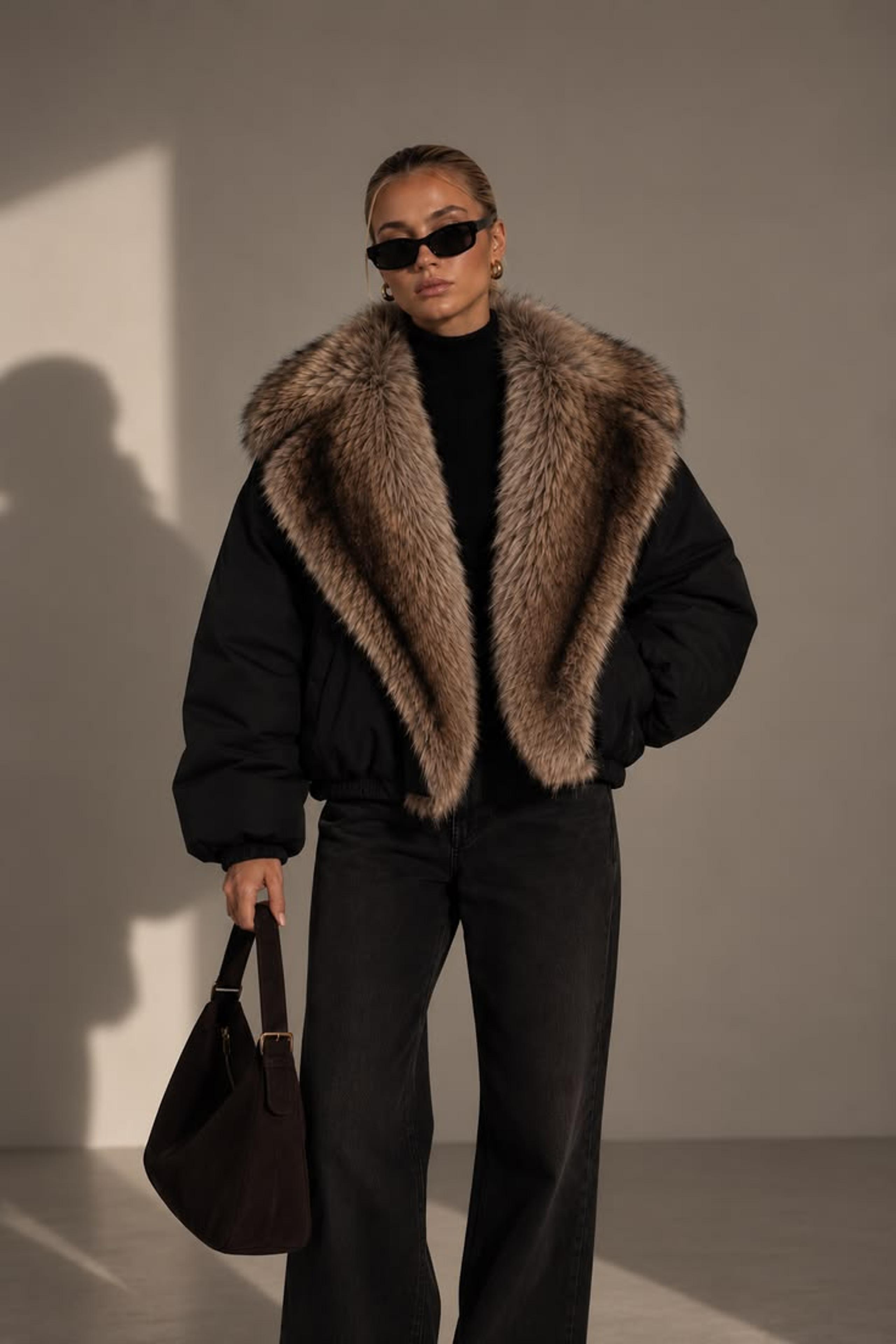 Woman in a coat with a faux fur trimmed collar on an autumn city street
