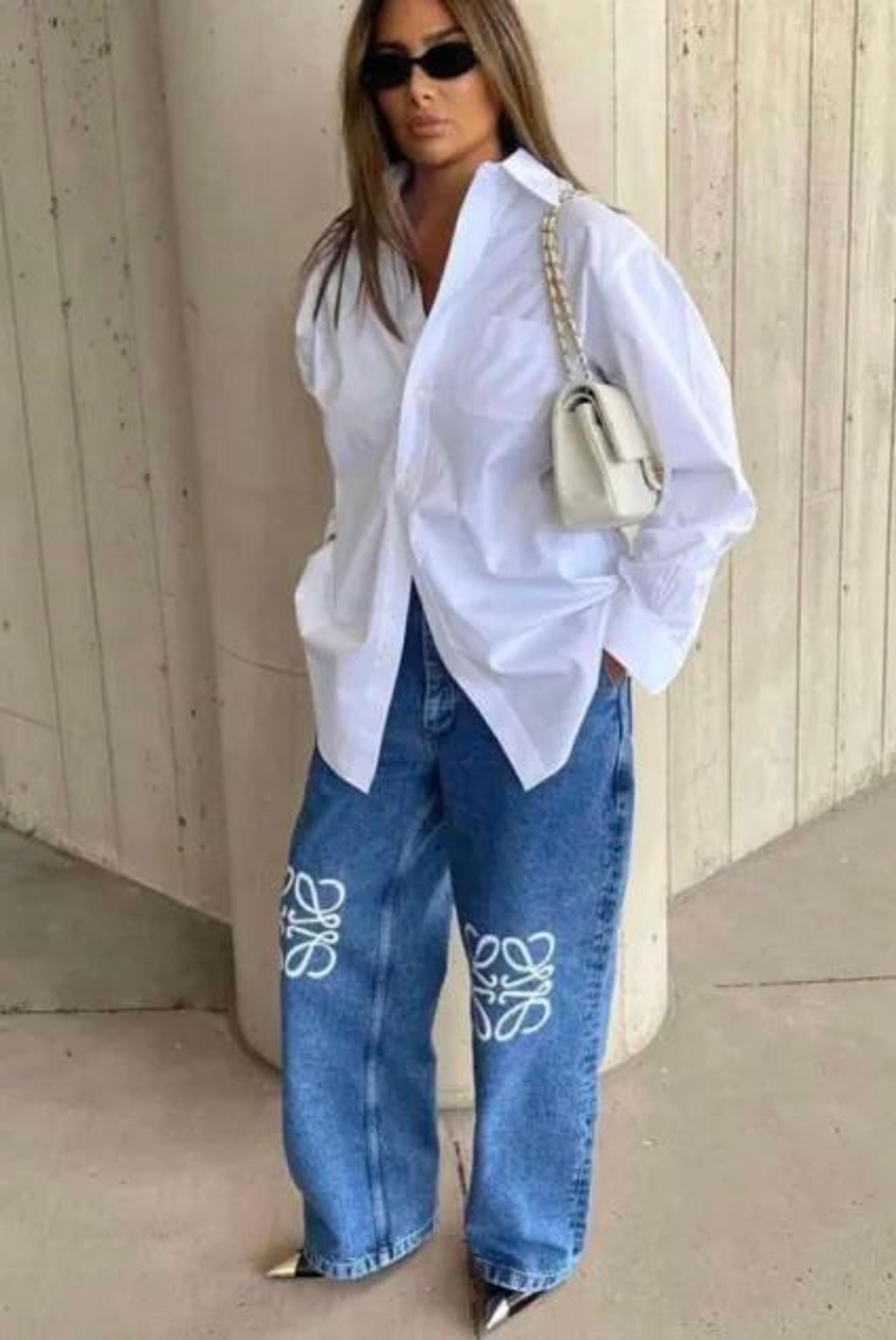 Oversized white shirt, Loewe anagram jeans and a white chain bag