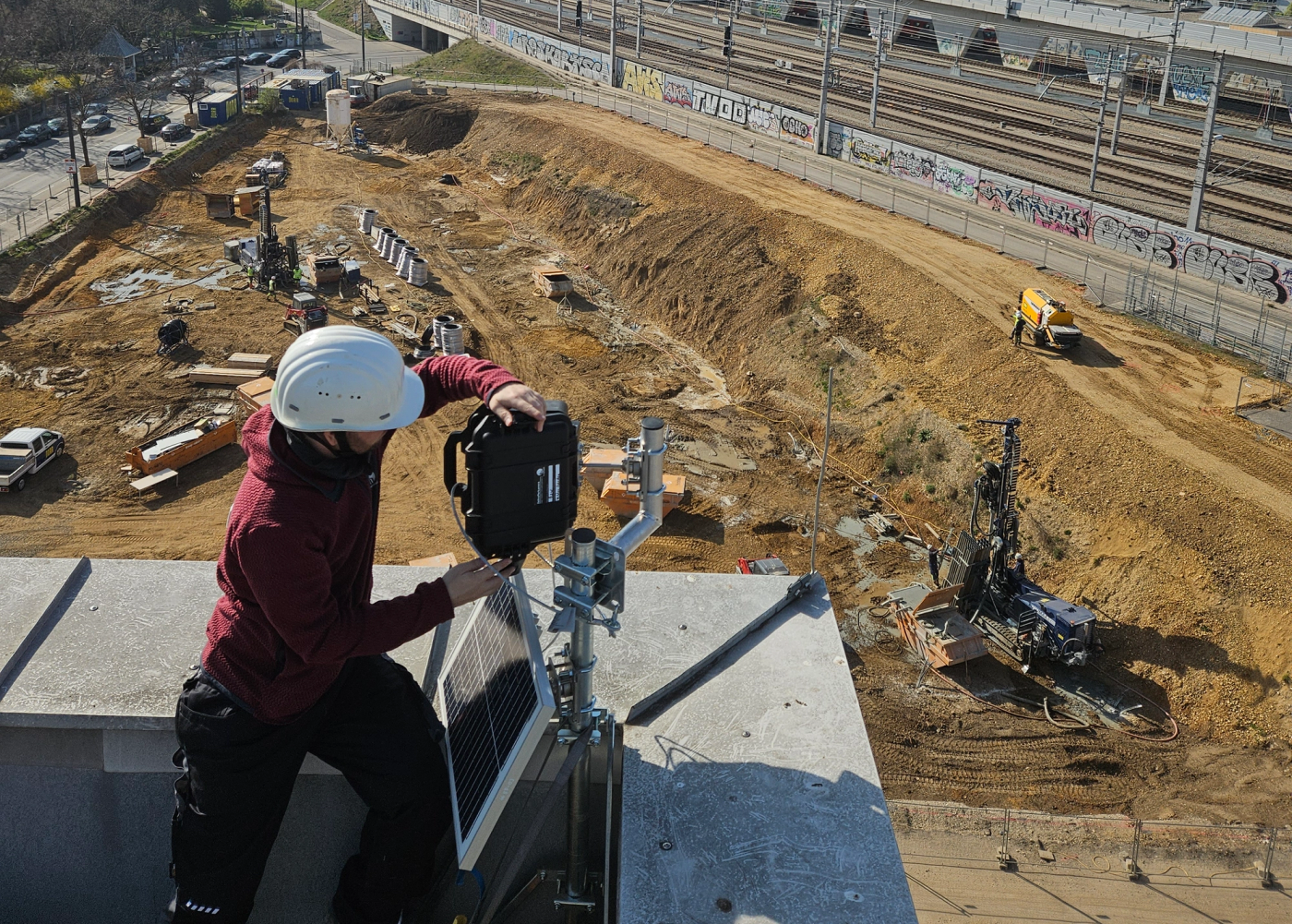 Man mounting a construction camera