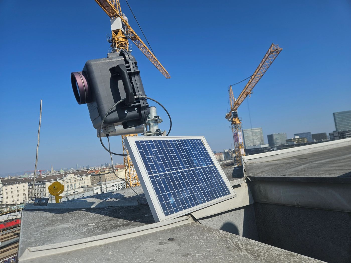 Construction monitoring camera overlooking a long-term building project
