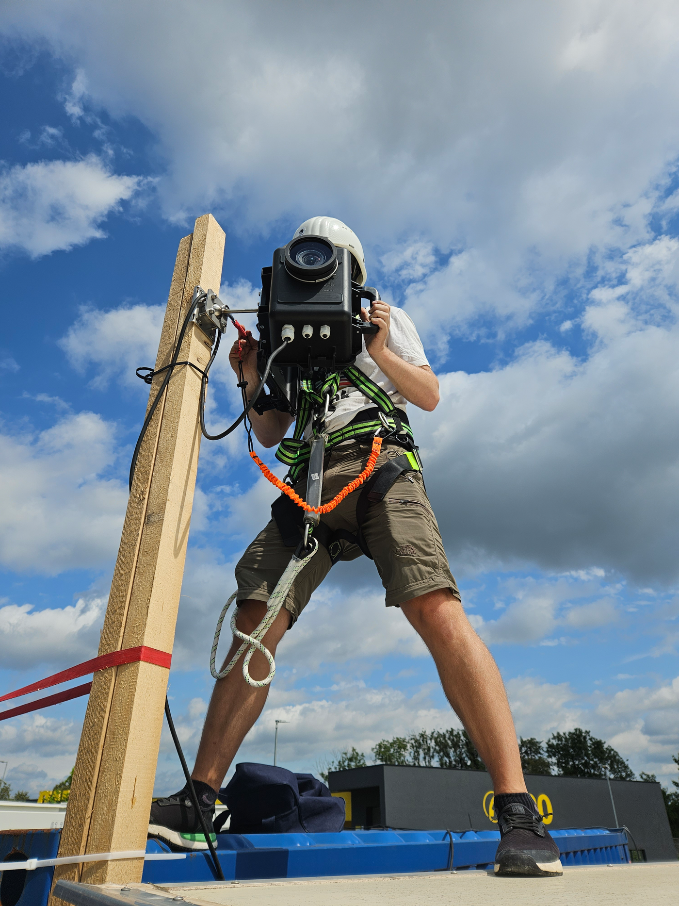 A full service construction timelapse company worker mounting a long term timelapse camera