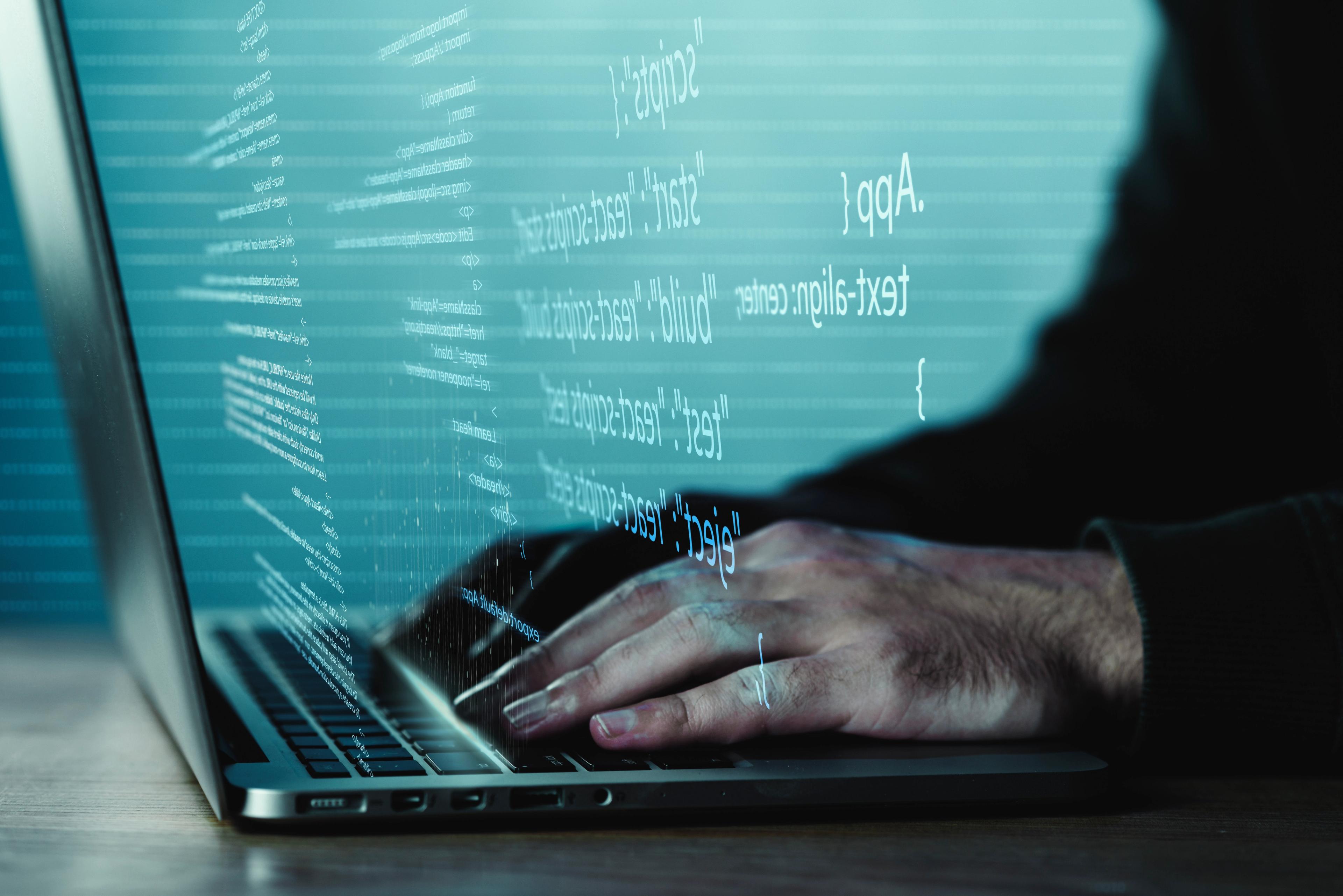 programming-background-with-person-working-with-codes-computer