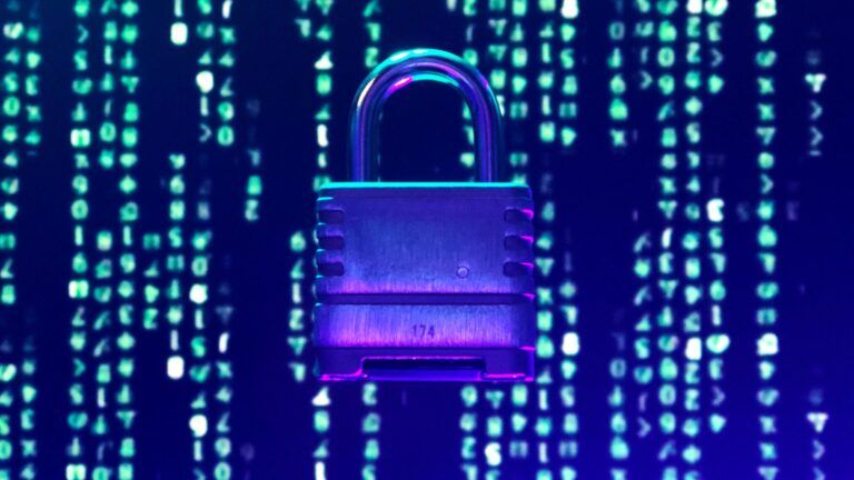 Padlock on a background of falling green digital code.