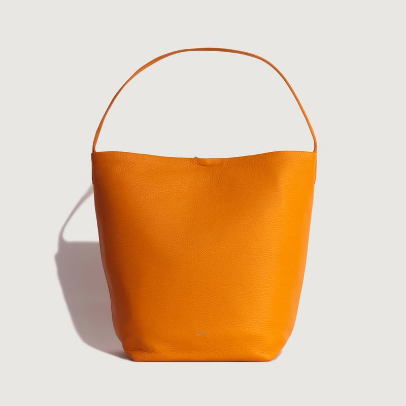 Large leather bag that says quality