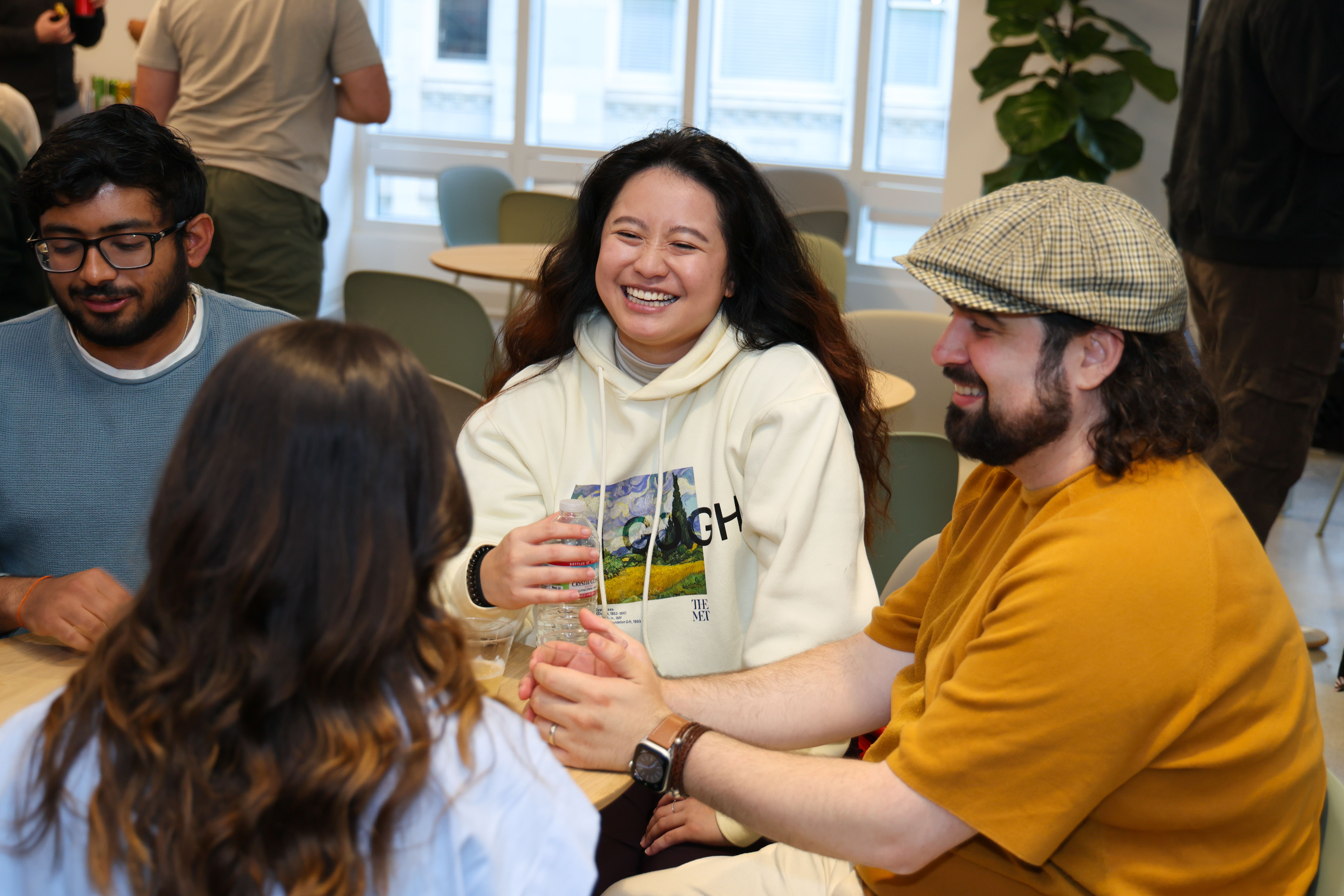 Guests playing cards at Chalk's Office Warming party.
