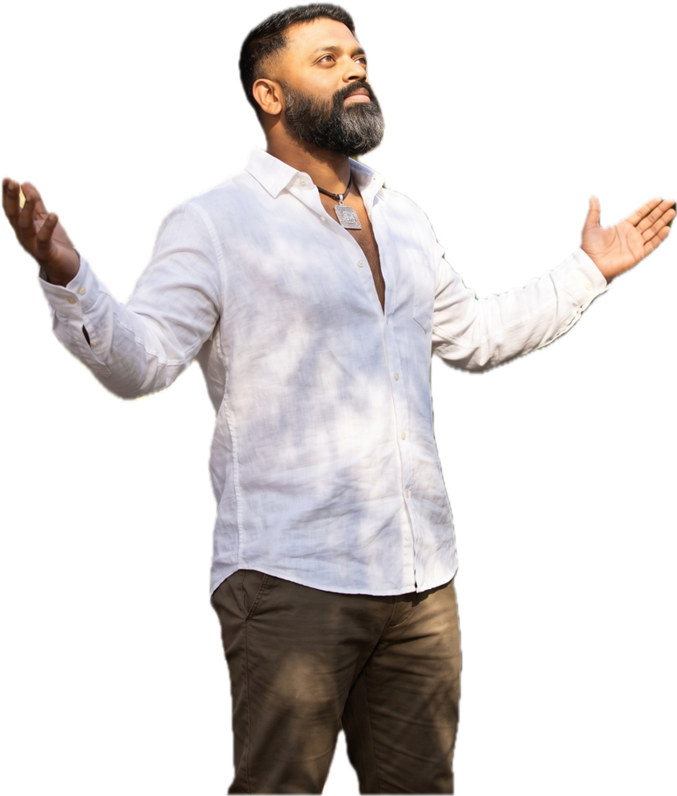 Dr. Ishan Shivanand, arms open to the rising sun