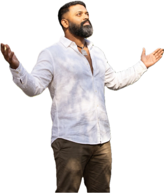 Dr. Ishan Shivanand, arms open to the rising sun