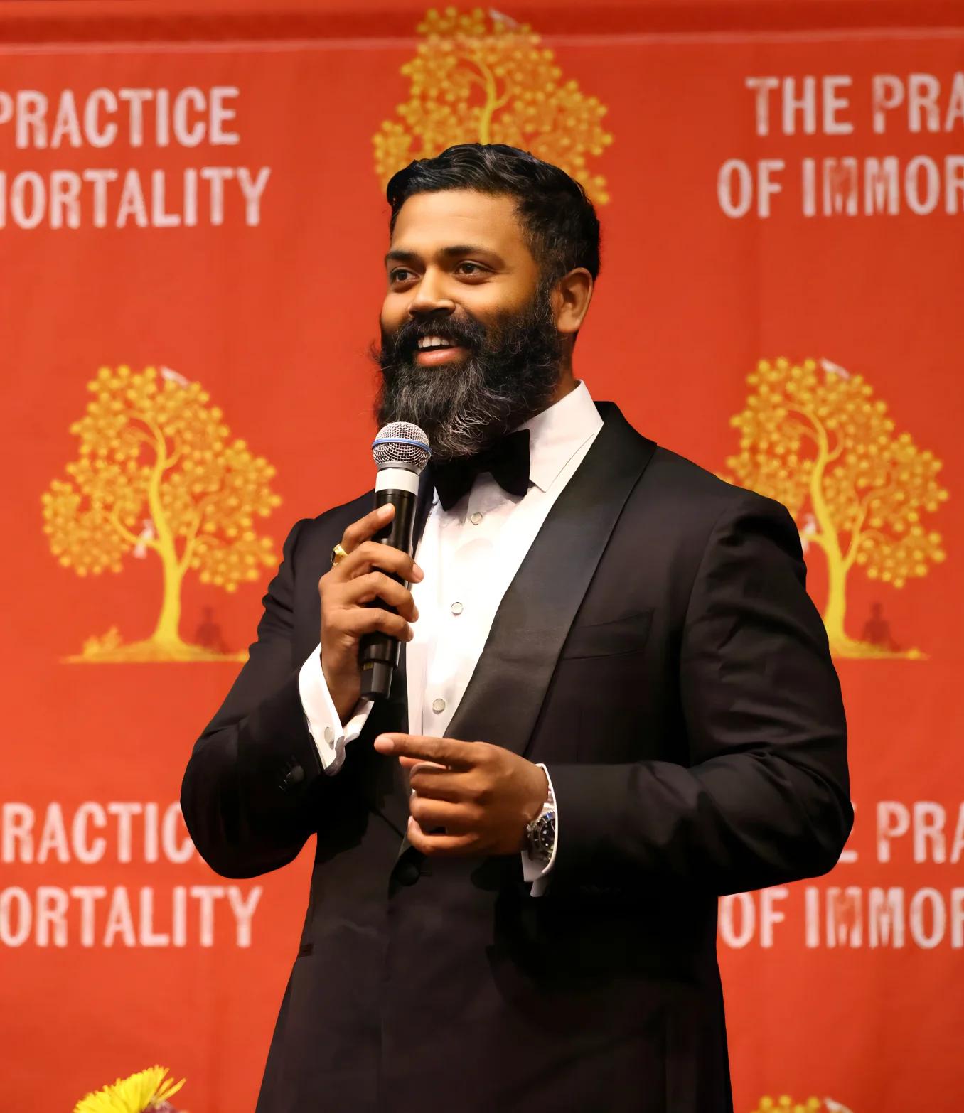 Dr. Ishan Shivanand, arms open to the rising sun