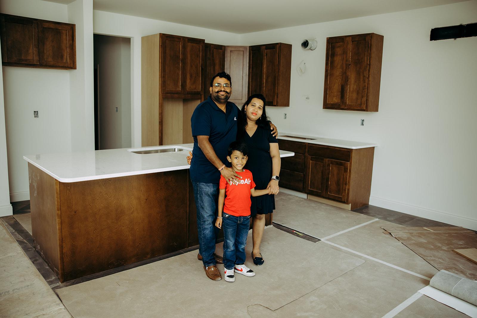 Family in kitchen of home