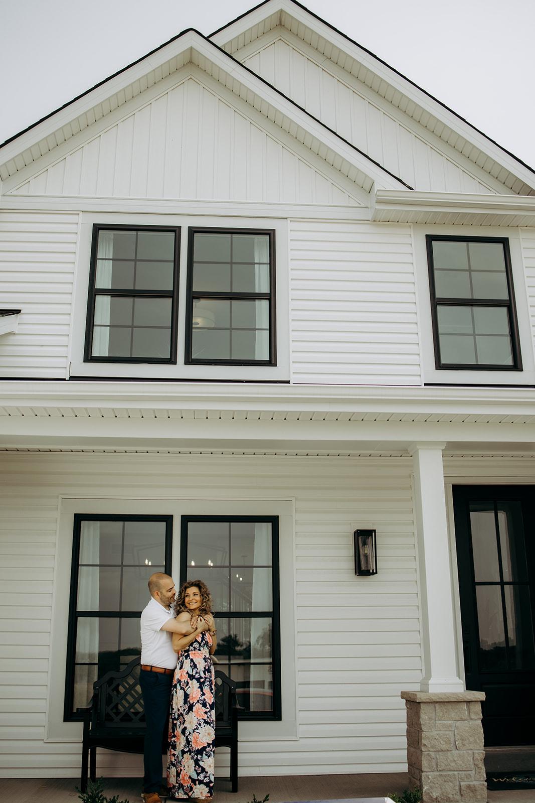 Couple standing in front of a new home from gentry homes