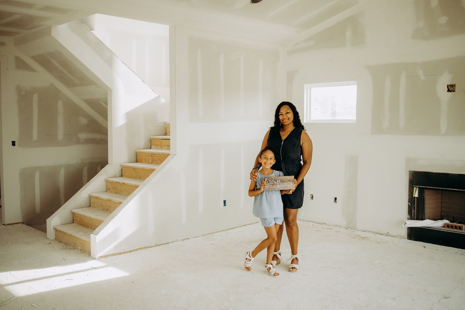 Mother and daughter in home under construction 