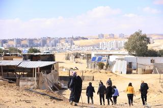 A group of people walking in Ras Jrabah