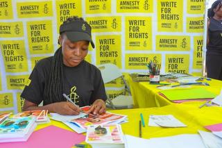 a person writes letters of solidarity