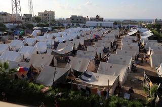	Tents for Palestinians seeking refuge are set up on the grounds of a United Nations Relief and Works Agency for Palestine Refugees (UNRWA) centre