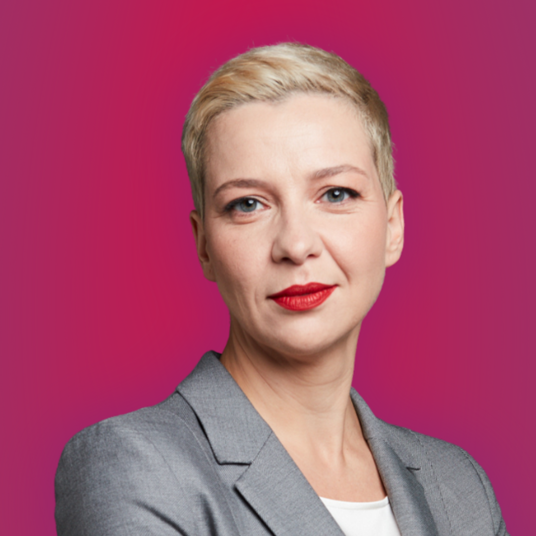 Maryia Kalesnikava standing against a pink background