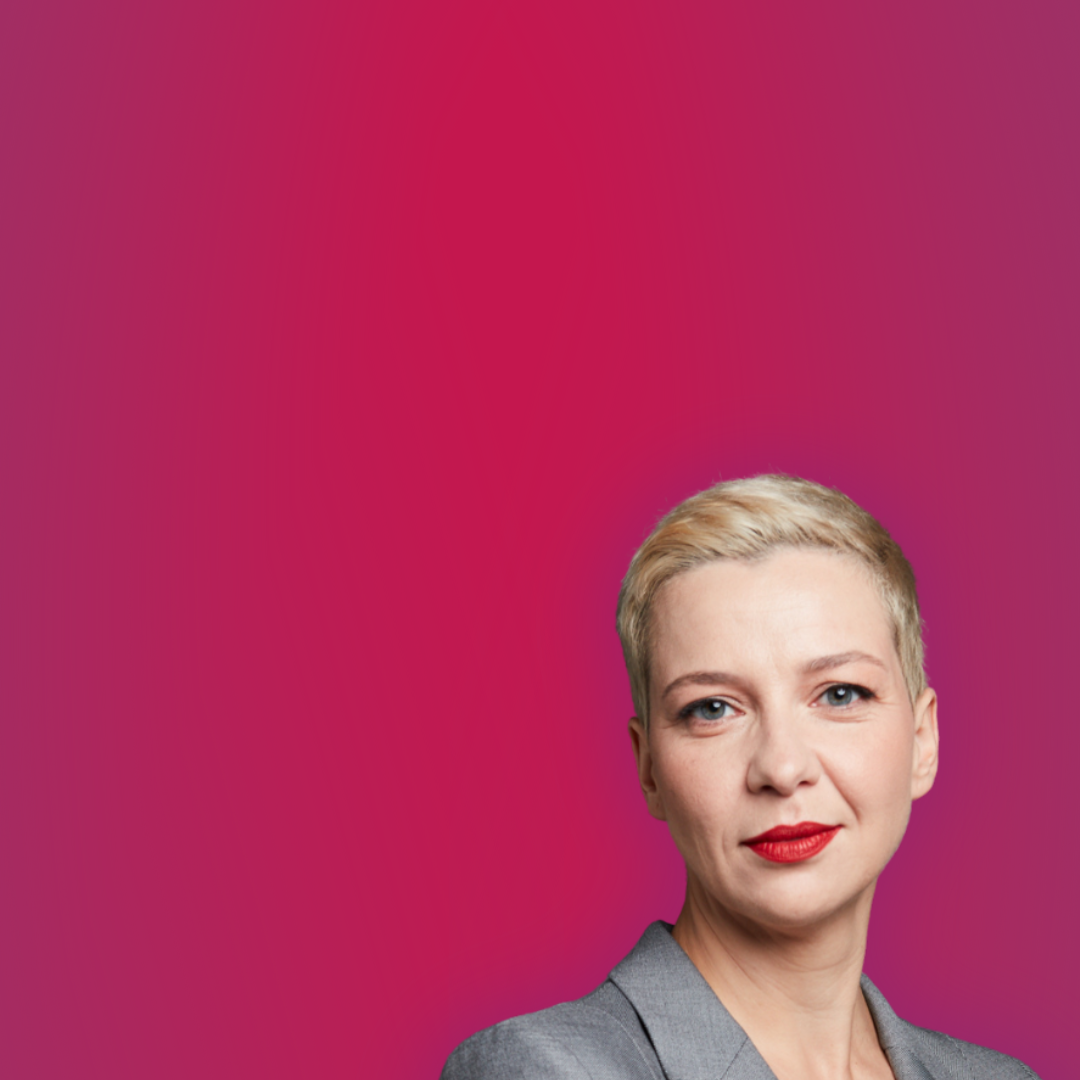 Maryia Kalesnikava standing against a pink background
