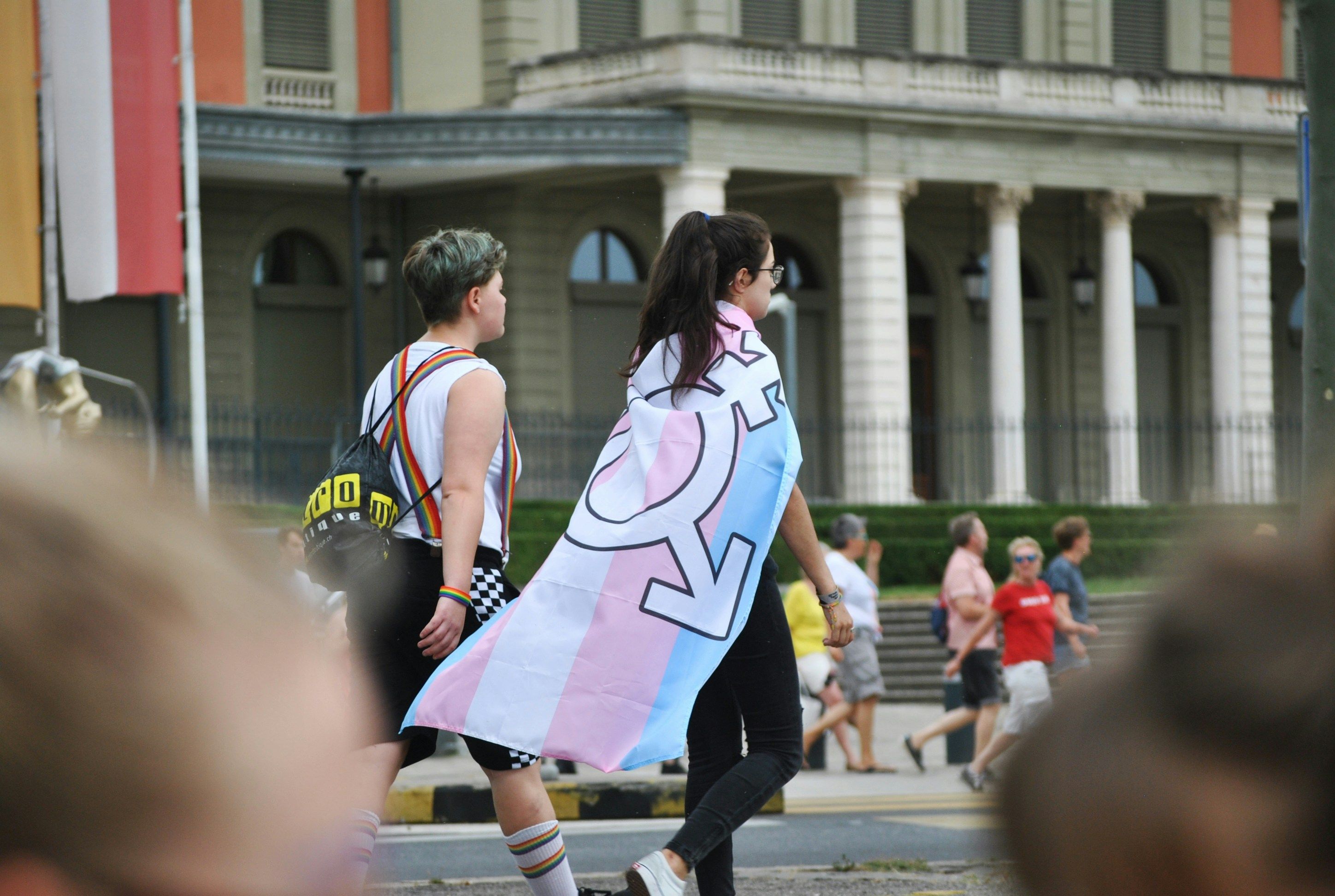 person wearing a trans pride flag